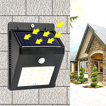 Black solar security LED light for outdoor use.
